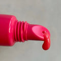 Rhode Peptide Lip Tint Guava Spritz shade on lips close up