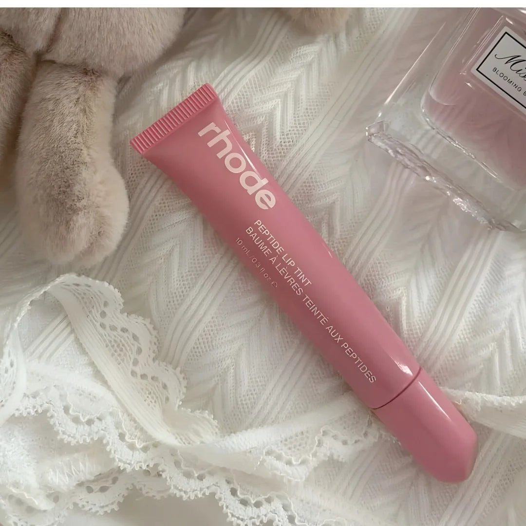Buildable pink glossy lip tint Rhode Peptide